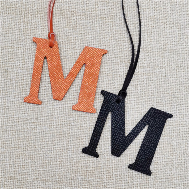 XMESSUN New English Letters M  - Monogram Keychain Leather review and price
